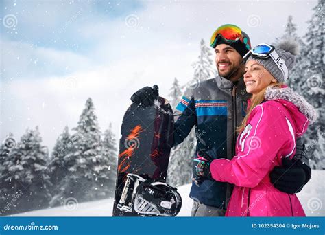 Couple Enjoy Skiing on Mountain Stock Photo - Image of skis, female ...