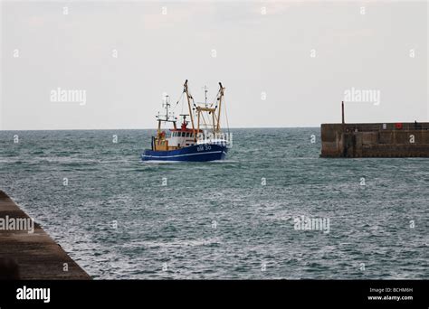 A Fishing Boat Returning To Port Stock Photo Alamy