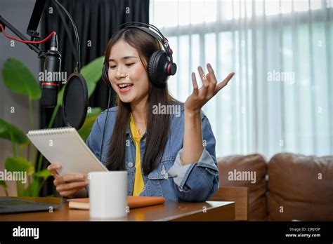 Happy Asian Girl Record A Podcast With Headphones And Microphone