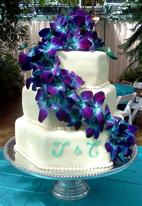 Pin By Field And Floral On Cake Flower Ideas Orchid Wedding Cake Blue Orchid Wedding Tiered