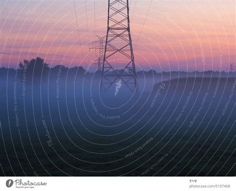 The Energy Awakens High Voltage Overhead Line In The Morning Fog At