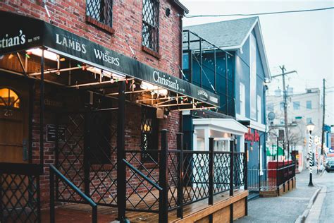 Bar Building Facade Against Walkway In Town · Free Stock Photo