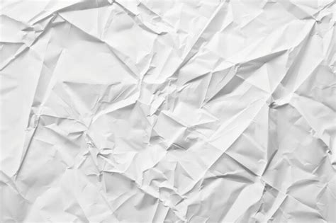 Crumpled White Paper Texture With Visible Folds And Wrinkles Closeup