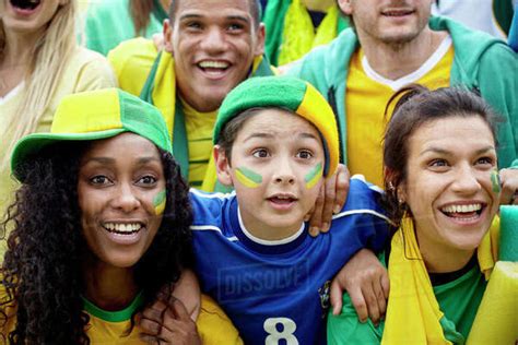 Brazilian football fans watching football match - Stock Photo - Dissolve