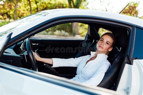 Beautiful Female Blonde Driver Behind The Wheel Of A Car On The Road Stock Image Image Of