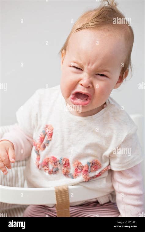 One Year Old Baby Girl Crying While Being Displeased Stock Photo Alamy