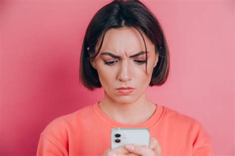 Free Photo Young Woman Is Feeling Sad Unhappy Angry While Reading Sms