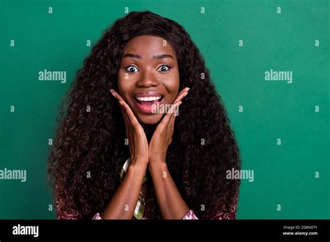 Photo Of Excited Funky Curly Dark Skin Woman Dressed Red Shirt Arms