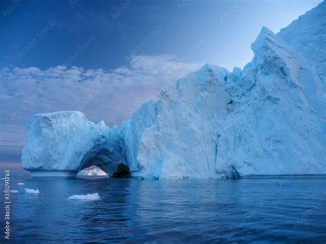 Iceberg at sunset. Nature and landscapes of Greenland. Disko bay. West ...