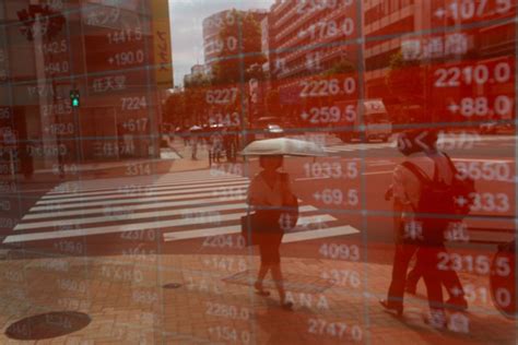 Japan Seeks To Calm Markets Nerves After Stock Price Fluctuations By