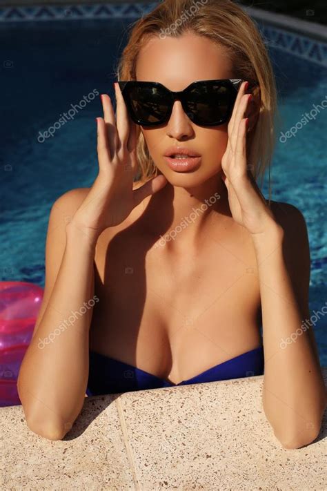 Sexy Woman With Blond Hair In Elegant Bikini With Sunglasses Stock