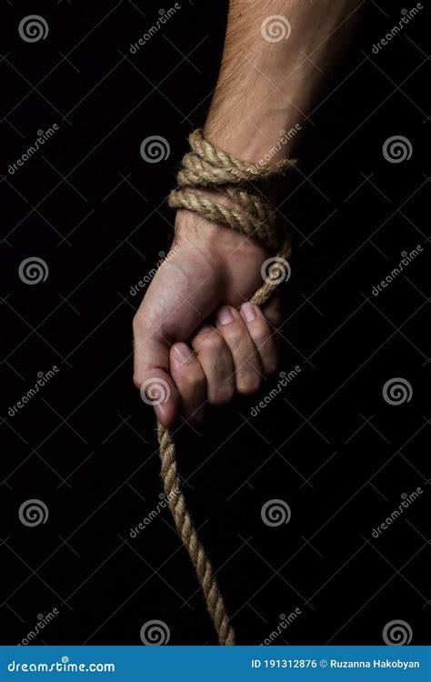 Male Hand Holds A Rope On A Black Background Stock Photo Image Of