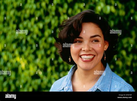 Portrait Of A Latina Woman In Park Smiling Stock Photo Alamy