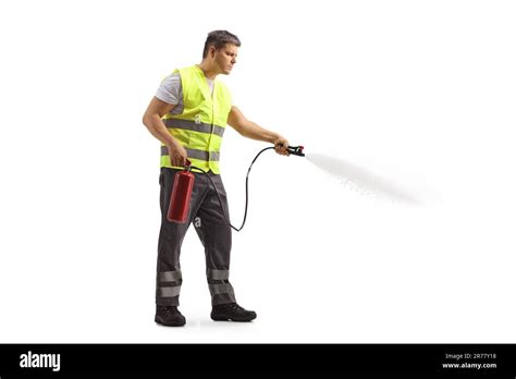 Man In A Reflective Safety Vest Using A Fire Extinguisher Isolated On