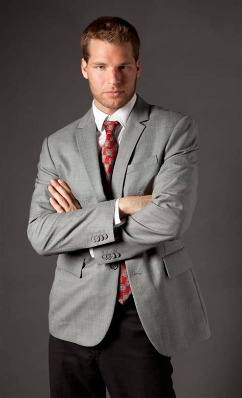 Man In Suit With Crossed Arms Stock Photo Image Of Poised Composure