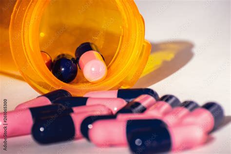 Close Up Of Pink And Blue Amoxicillin Antibiotics Capsule Pills