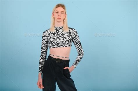 Youth Transgender Lgbt Looking At Camera While Posing Isolated Over Nude Color Background Stock
