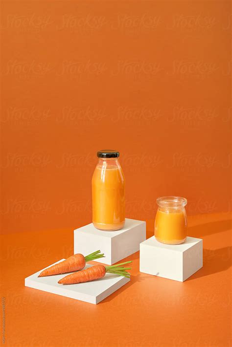 "Fresh Organic Carrot Juice" by Stocksy Contributor "Marc Tran" - Stocksy