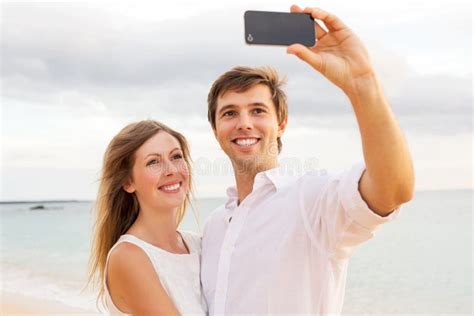 Romantic Young Couple In Love Man Holding Surprise Rose For Beautiful