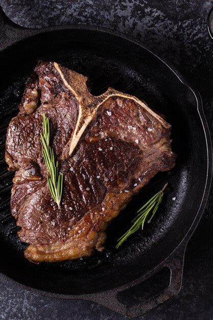 Premium Photo Grilled Beef Steak With Spices In A Frying Pan