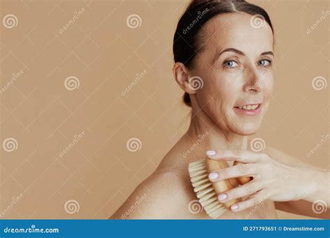 Modern 40 Years Old Woman Isolated On Beige Background Stock Image