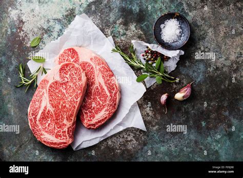 Raw Fresh Marbled Meat Black Angus Steak Ribeye And Seasonings On Metal