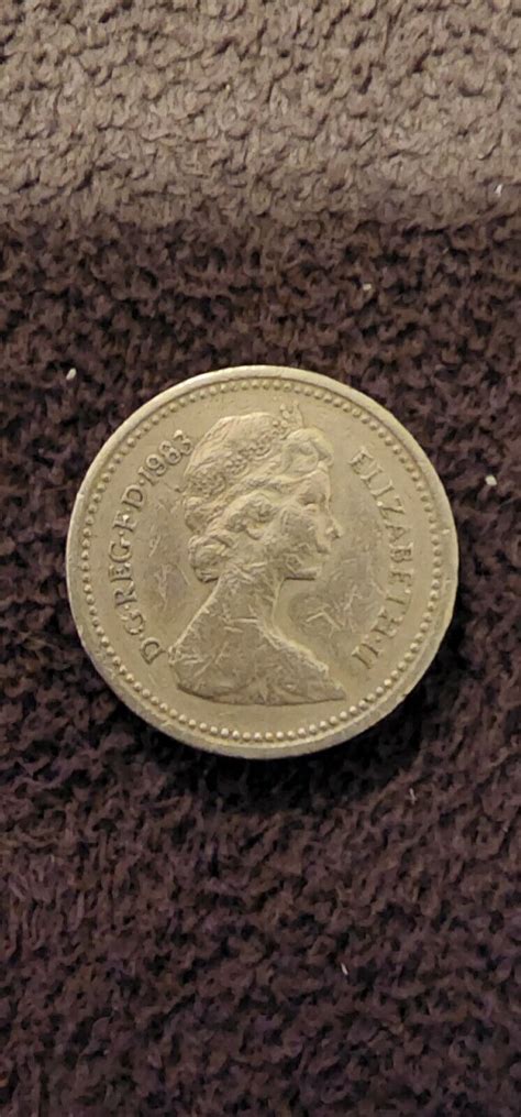 1983 ROYAL ARMS ONE POUND COIN ERROR UPSIDE DOWN DECUS ET TUTAMEN