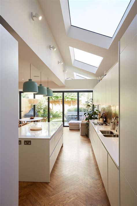 Modern White Kitchen Design with Skylights