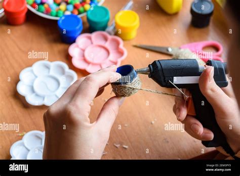 The Girl S Hands Apply Hot Melt Glue To The Elements Of The Craft Gluing Twine Stock Photo Alamy