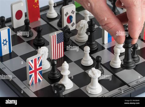 Politicians Hand Moves A Chess Piece Conceptual Photo Of A Political