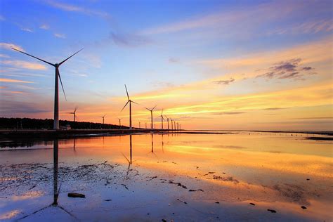 Wind Turbines On Wetland During Sunset Photograph By Samyaoo Fine Art America