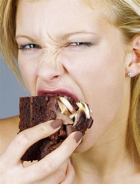 Woman Eating Cake Photograph By Jason Kelvin Science Photo Libray