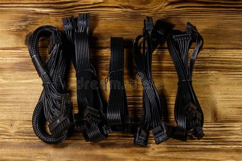 Set of Cables for Computer PSU on Wooden Desk Stock Photo - Image of ...