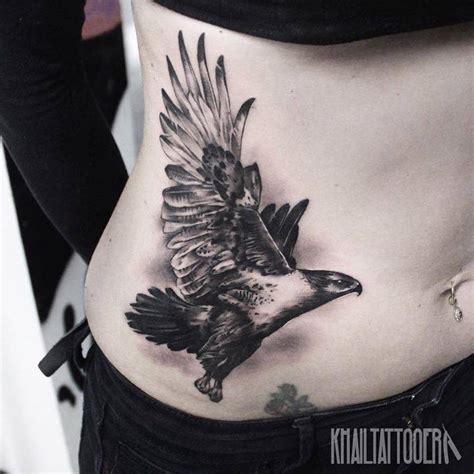 Black and grey hawk tattoo on Janet.