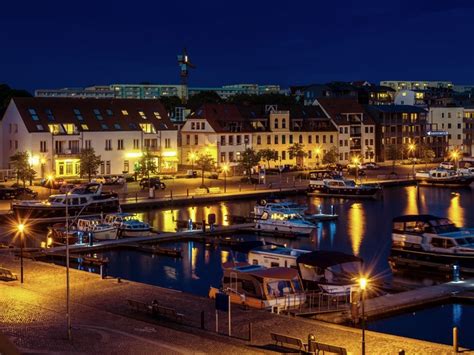 waren germany houses rivers marinas motorboat night street