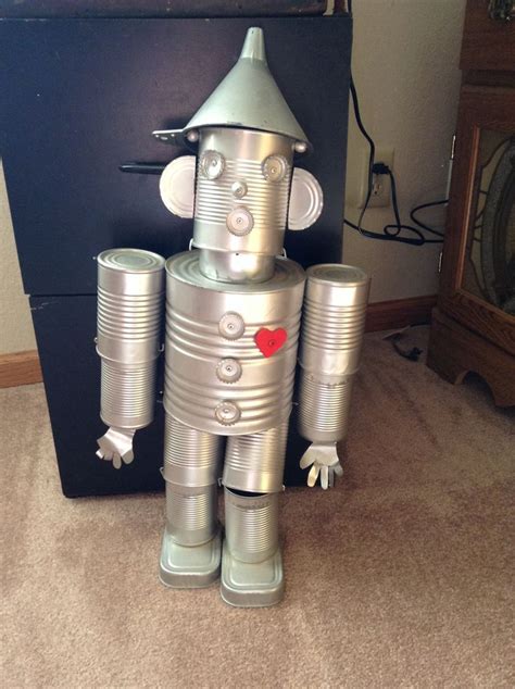 The Tin Man Made Out Of Different Sized Cansbottle Capsand A Funnel