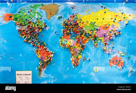 Push pins marking locations on a world map Stock Photo - Alamy