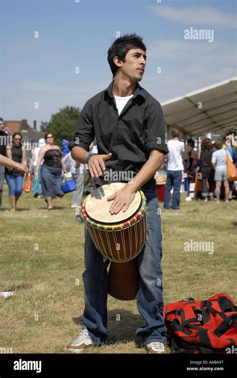 Man Playing Bongo Drum at Wimbledon Village Fair Stock Photo - Alamy