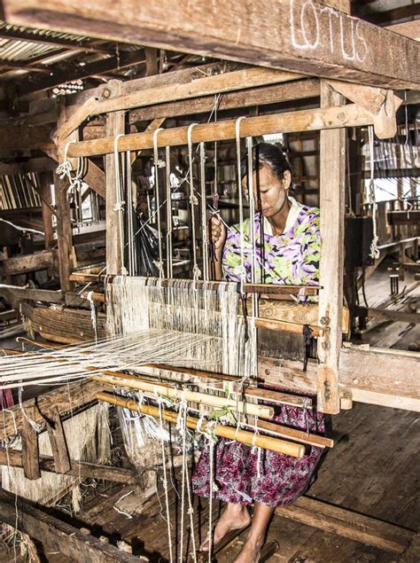 Burmese Woman Weaving Silk Textile With Traditional Loom In Myanmar