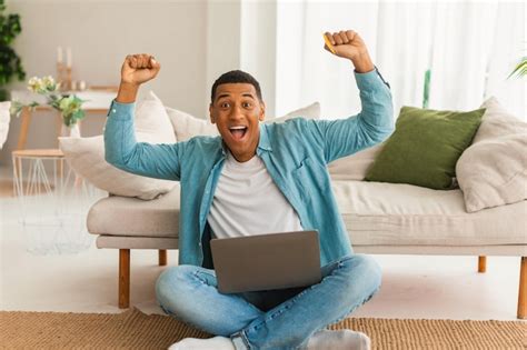 Premium Photo Satisfied Excited Millennial African American Man With