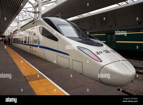 Chinese CRH5 High Speed Rail HSR fast train waiting at platform of ...