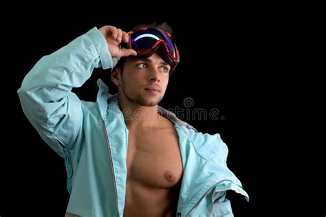Muscular Skier Or Snowboarder With Open Jacket On Naked Torso Stock