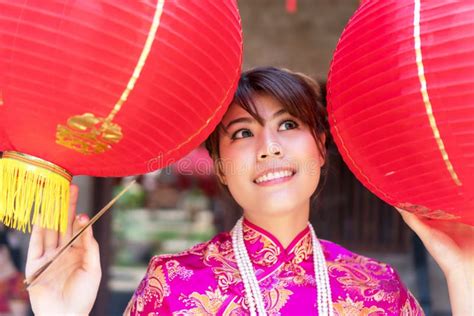 Smile Women Wear Cheongsam Red Dress Standing Between The Red Lantern