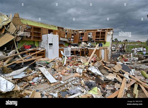 The remains of a kitchen surrounded by debris after severe storms in ...