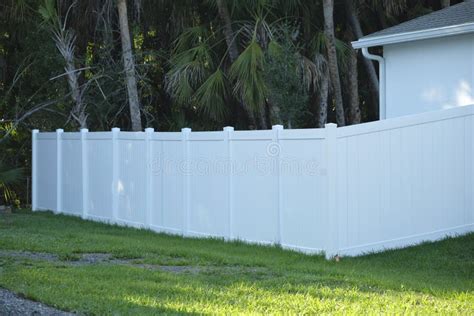 White Plastic Fence for Back Yard Protection and Privacy Stock Photo ...