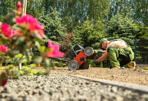 Landscaping Worker Checking His Gasoline Aerator 24524833 Stock Photo