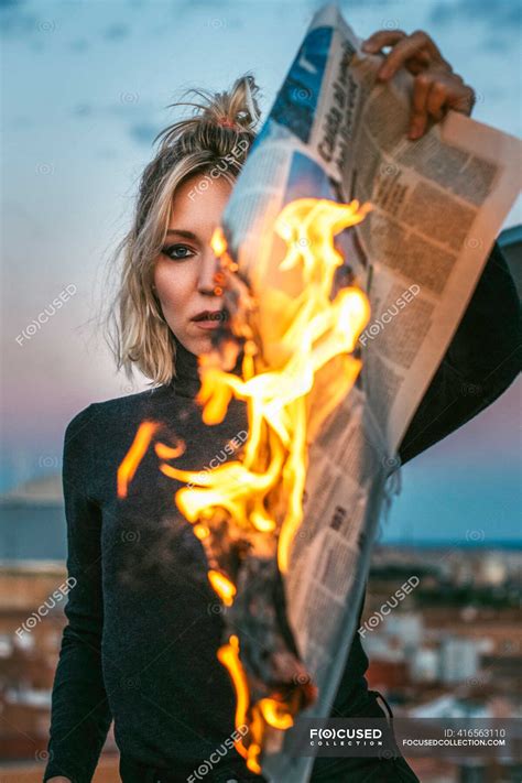 Blonde Woman Burning A Newspaper Awesome Community Stock Photo 416563110