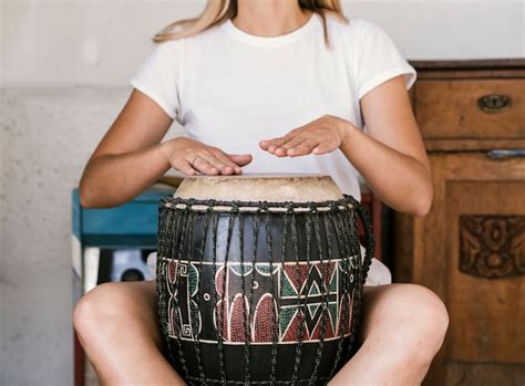 Free Photo | Young woman playing conga drum