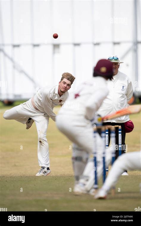 Cricket bowler in action Stock Photo - Alamy