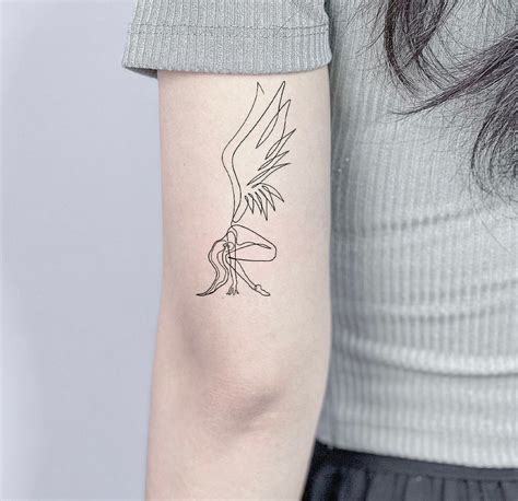 Tinkerbell Silhouette Tattoo Behind Ear